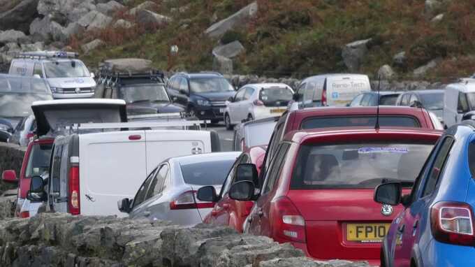 Dozens of illegally parked cars towed away in chaotic scenes at UK beauty spot