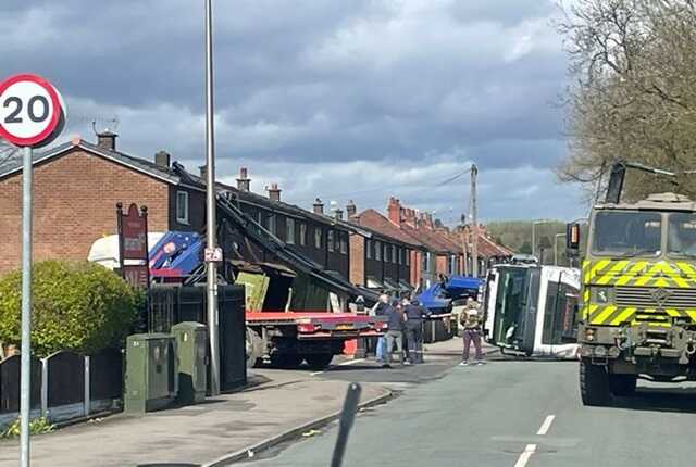 Terror as crane topples over and smashes straight through house roof on quiet street