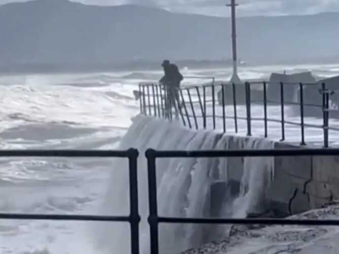 Terrifying moment giant wave washes a toddler away - before dad jumps in to rescue her