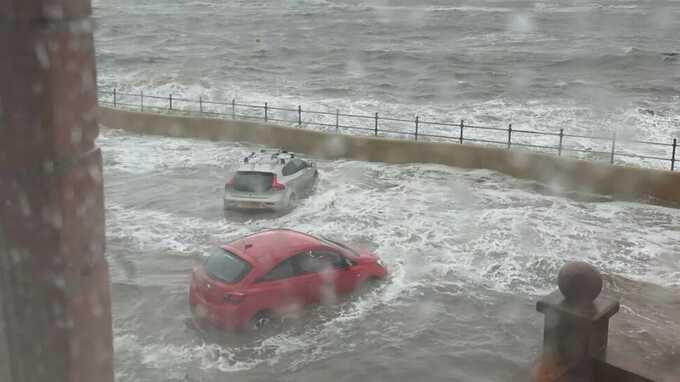 Lifeboat crew rescue people from cafe after flood waters rise