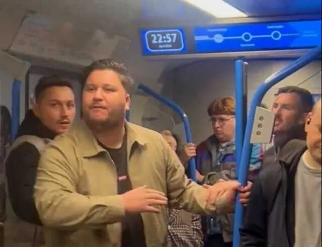 A man is reported to have verbally attacked train passengers with racist abuse and allegedly threatened a woman who filmed the incident