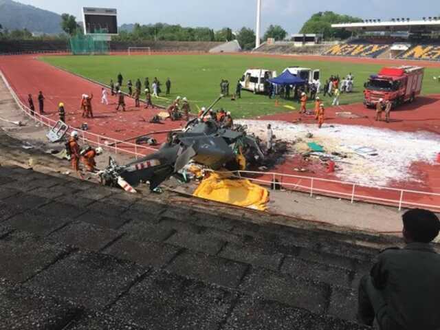 One of the choppers crashed at a sports complex in the naval base (Picture: ViralPress)
