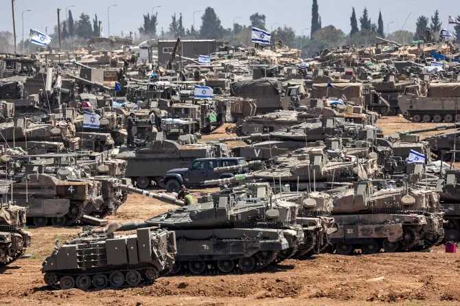 Israel orders evacuation of civilians from MORE areas in Rafah as tanks encircle city amid fears of full-scale invasion