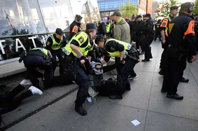 Protesters clash with riot police at Eurovision arena, shouting ’shame on you’