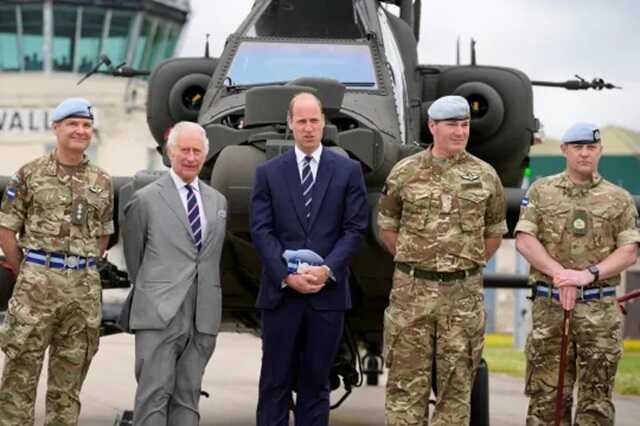 King Charles poses with service personnel after he officially handed over the role of Colonel-in-Chief of the Army Air Corps to Prince William, Prince of Wales (Picture: Reuters)