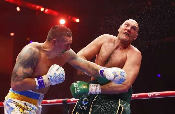 Oleksandr Usyk rushed to hospital with suspected broken jaw after Tyson Fury win, carried out of arena