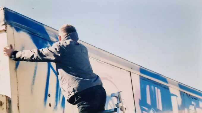 Banksy spotted in unseen photos painting his biggest ever work before he was famous