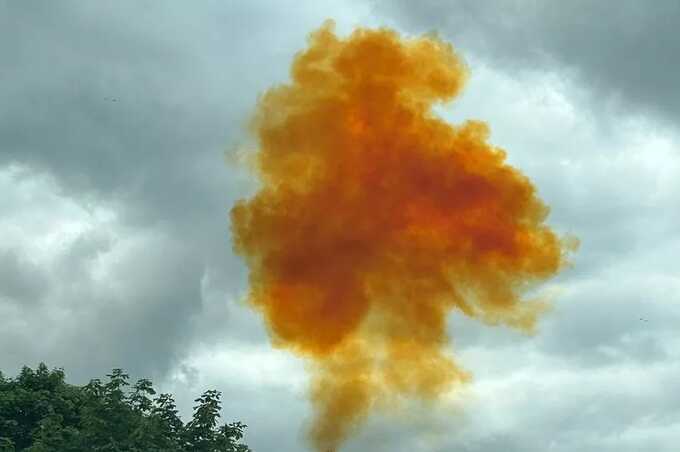 ’Chemical explosion’ prompts fears of a ’huge leak’ as an orange plume is spotted in the sky