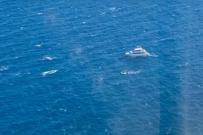 The search and rescue operation involved multiple vessels, police divers and the rescue helicopter.(Supplied: RACQ LifeFlight Rescue)
