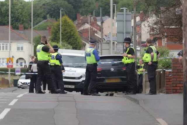Police are pictured at the scene in Dudley, West Midlands ( Image: Nick Wilkinson/Birmingham Live)