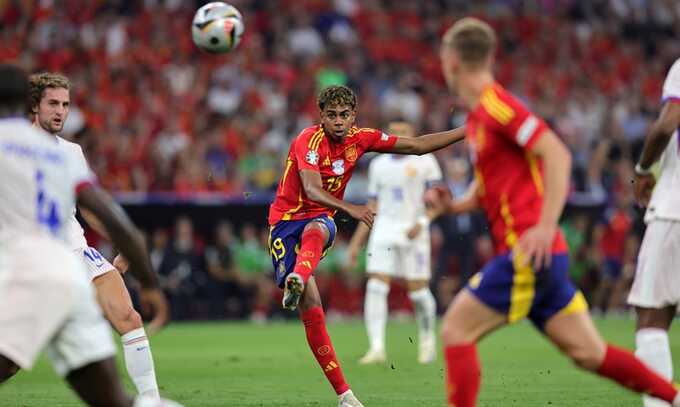 Lamine Yamal scores Spain’s superbly struck first, which arcs towards the top-left corner of Mike Maignan’s goal. Photograph: Christina Pahnke/sampics/Getty Images