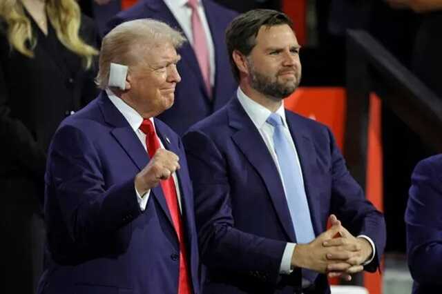 Trump clenches his fist next to US Senator from Ohio and 2024 Republican vice-president candidate J. D. Vance ( Image: AFP via Getty Images)