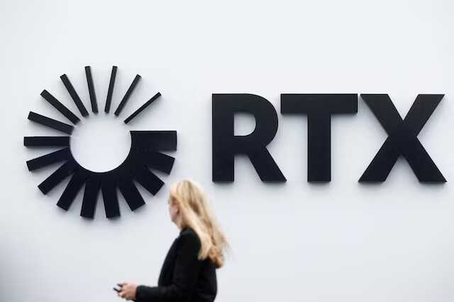 Visitor passes the Raytheon Technologies Corporation (RTX) logo at the 54th International Paris Air Show at Le Bourget Airport near Paris, France, June 22, 2023. REUTERS/Benoit Tessier/File Photo Purchase Licensing Rights