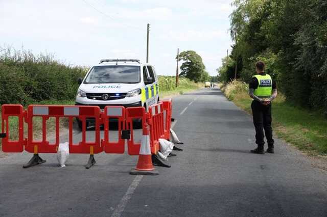 Police close to the scene in Thorganby ( Image: PA)