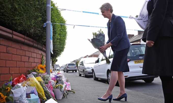 Yvette Cooper lays flowers near the scene in Hart Street. Photograph: James Speakman/PA