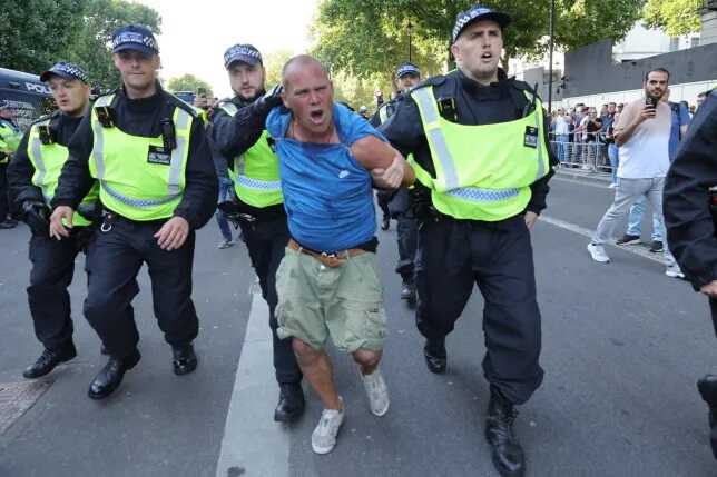 Far-right march through London and clash with police over Southport stabbings