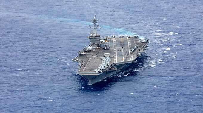 US deploys aircraft carrier, warships, and fighter squadron to Middle East as region braces for Iranian retaliation