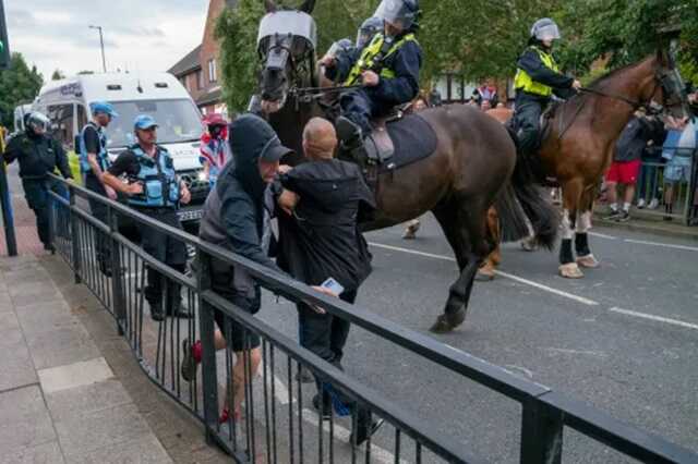 Armed with bricks, some protestors threw them towards police (Picture: Getty)