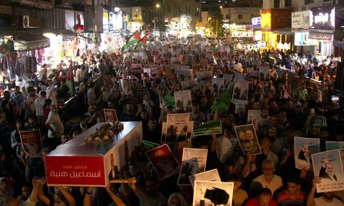 People protest against Ismail Haniyeh’s assassination and Israeli attacks on Gaza in Amman, Jordan. Photograph: Anadolu/Getty Images