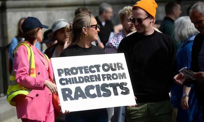 Demonstrators take part in a United Against Racism rally in Belfast. Photograph: PA