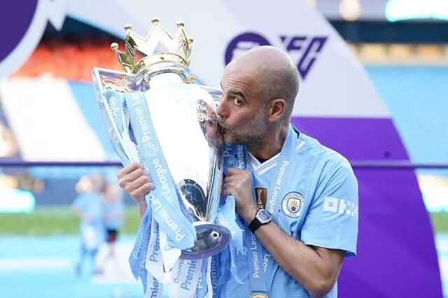 Manchester City manager Pep Guardiola with the Premier League trophy ( Image: PA)