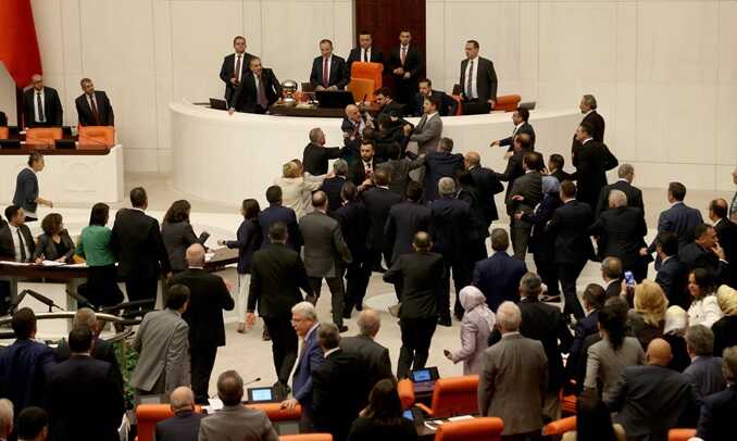 Turkey’s ruling AK party (AKP) and opposition lawmakers scuffle during an extraordinary meeting of the Turkish parliament to discuss jailed opposition lawmaker Can Atalay’s return to the assembly. Photograph: Çağla Gürdoğan/Reuters