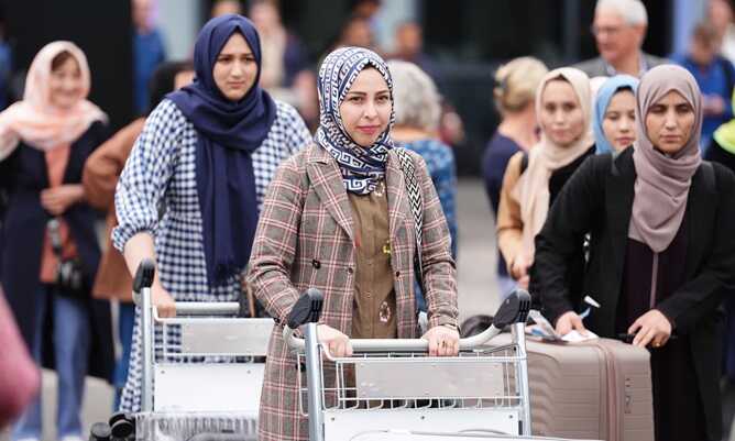 The medical students arriving at Edinburgh airport. Photograph: Andrew Milligan/PA