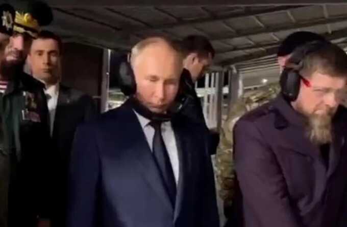 Putin mocked for wearing headphones upside down to stop his ‘thinning hair being ruffled’