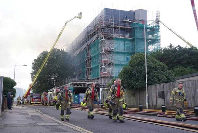 Firefighters at the scene ( Image: PA)