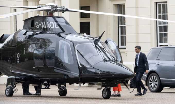 Rishi Sunak boarding a helicopter to visit a pharmacy in Southampton in May 2023. Photograph: Jeremy Selwyn/eyevine