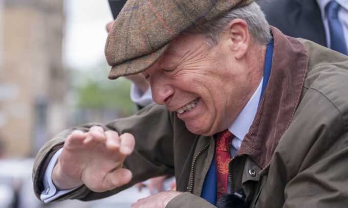 Nigel Farage reacts as something is thrown towards him in Barnsley, South Yorkshire, while on the general election campaign trail. Photograph: Danny Lawson/PA