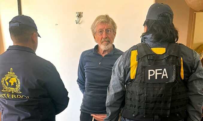 Leonardo Bertulazzi (centre) during his arrest in Buenos Aires. Photograph: Argentina security ministry/AFP/Getty Images