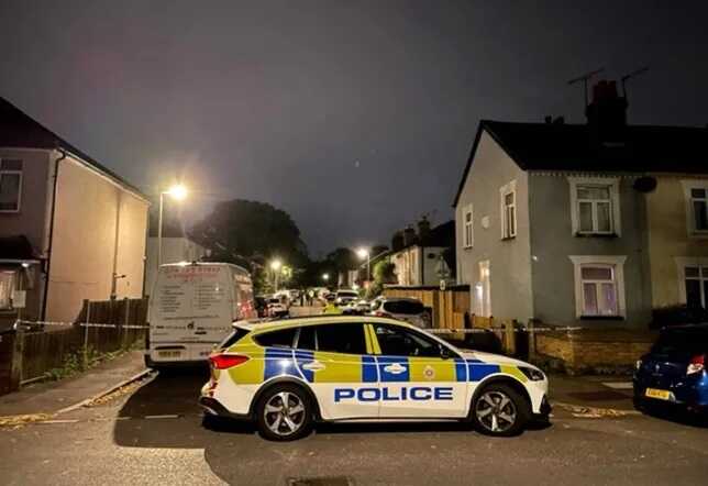 Three children and a man found dead at a house in Surrey