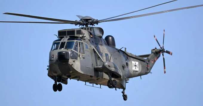 A Royal Navy serviceman has died after a Merlin helicopter crashed into the English Channel