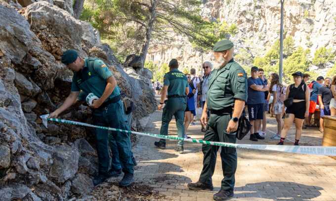 Spanish emergency services search for the missing tourist near Torrent de Pareis, Sa Calobra, after strong winds and heavy rain hit the island. Photograph: Cati Cladera/EPA