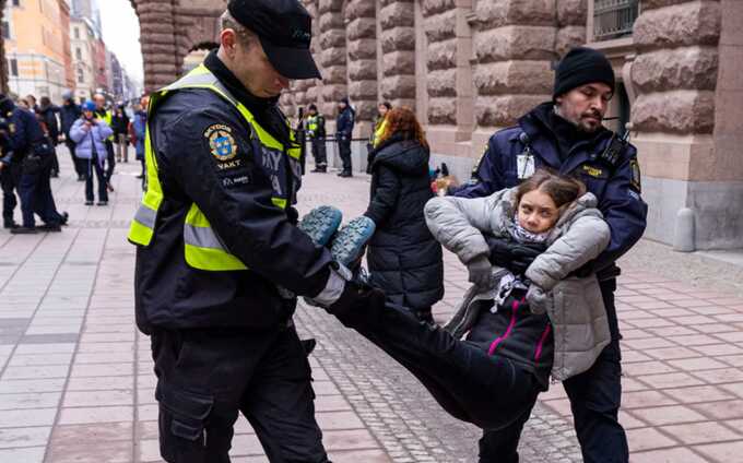 Greta Thunberg is arrested by police officers during a climate protest outside the Swedish parliament in Stockholm, Sweden, in March. Photograph: Michael Campanella/Getty Images