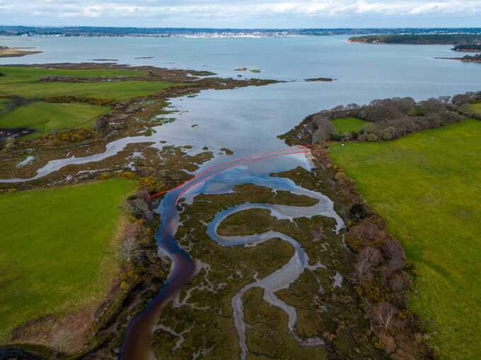 A barrier contains reservoir fluids in danger of spilling into Poole Harbour from Ower Bay, following an oil leak in March 2023. Photograph: Bloomberg/Getty Images