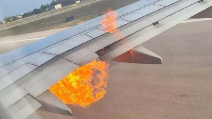 A Ryanair plane caught fire, forcing nearly 200 passengers to evacuate using emergency slides