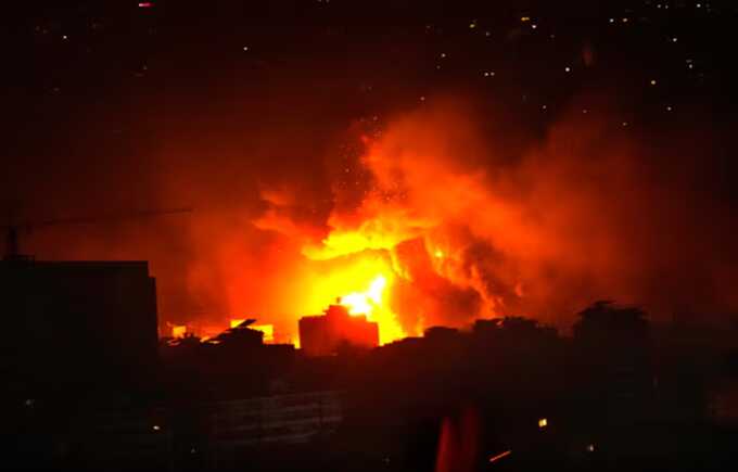 Flames and smoke rise from an Israeli airstrike in Dahiyeh, southern Beirut, early on Sunday. Photograph: Hussein Malla/AP