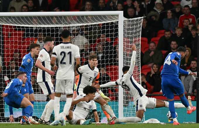 Vangelis Pavlidis scores Greece’s stoppage-time winner. Photograph: Glyn Kirk/AFP/Getty Images