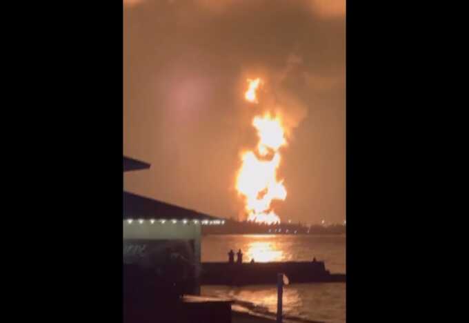 Russian oil refinery explodes, sending a 200ft tower of flames into the sky