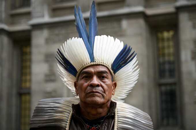 Cacique Bayara, leader of the Pataxo Geru-Tucuna village, located in the municipality of Acucena in Minas Gerais, Brazil, appears outside the Rolls Building of the High Court amid a lawsuit against the BHP Group over the 2015 collapse of the Mariana dam in Brazil, in London, Britain, October 21, 2024. REUTERS/Jaimi Joy Purchase Licensing Rights