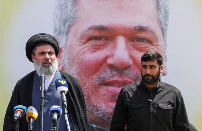 Hezbollah official Hashem Safieddine (L) pictured in June speaking during the funeral of Taleb Abdallah, also known as Abu Taleb, a senior field commander of Hezbollah. Photograph: Mohamed Azakir/Reuters