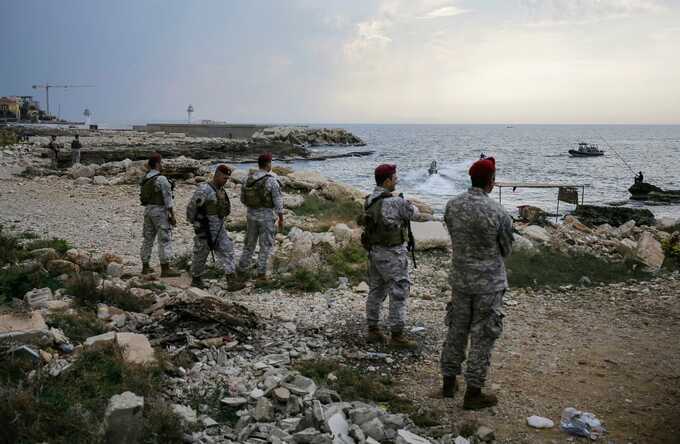 Lebanese soldiers inspect the beach at the reported landing site in the northern coastal town of Batroun. Photograph: Ibrahim Chalhoub/AFP/Getty Images