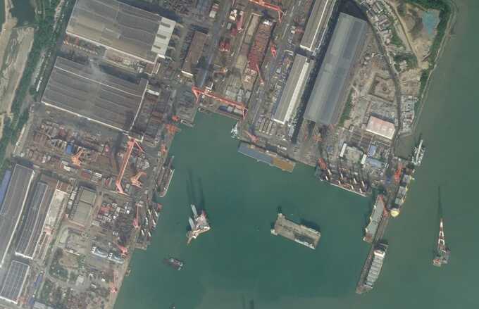 This satellite image captured on October 23, 2024, shows an entirely new class of Chinese vessel with a large open flight deck at a shipyard in the southeastern end of the country. Planet Labs PBC