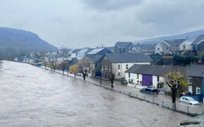 The River Taff has burst its bank in Pontypridd, flooding homes and a nearby street