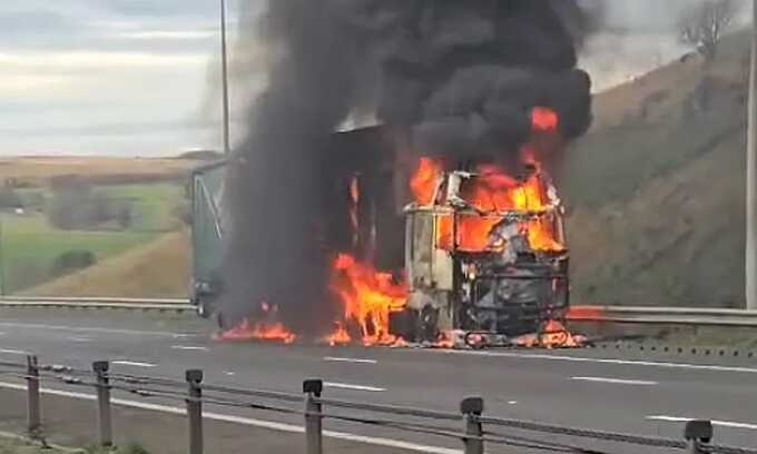 Lorry carrying sawdust bursts into flames, shutting down major motorway