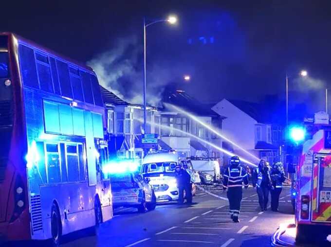 Firefighters douse the house with water after the explosion (Picture: UKNIP)