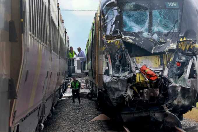 At least 15 injured as high-speed train crashes into fire truck