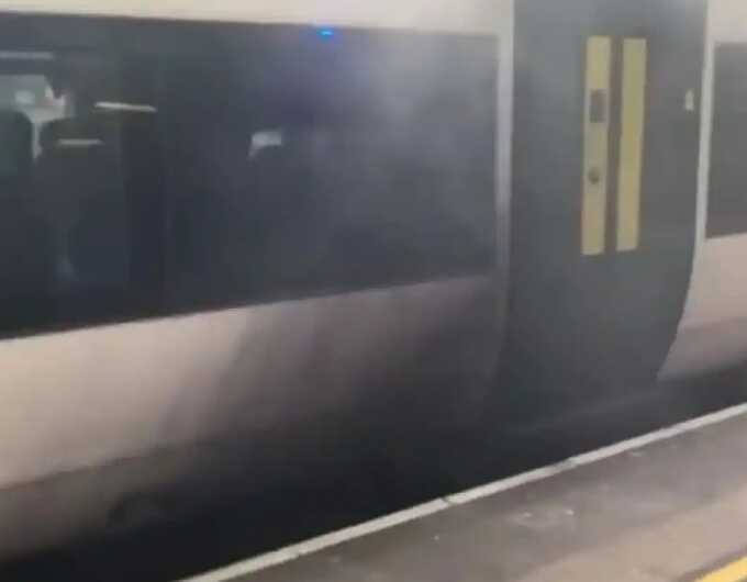 Train ignites at Gatwick Airport station, smoke billows from under carriage